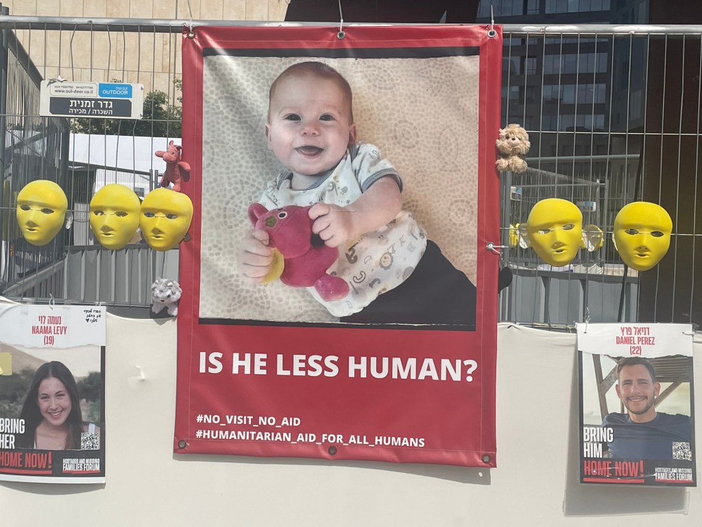 Picture taken at hostage square in Tel Aviv of a poster that states in Hebrew: Our heart is left in Gaza.
